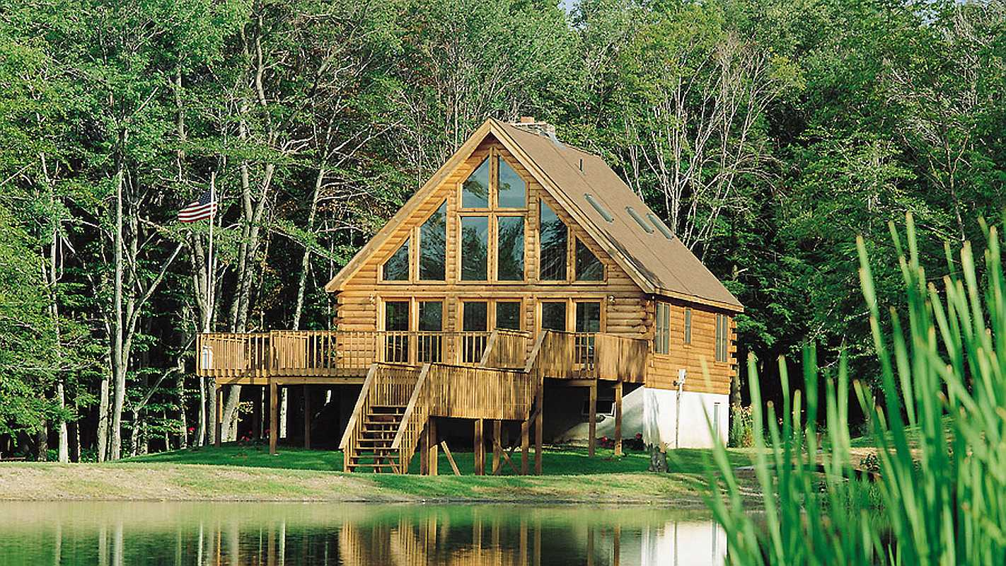 Log cabin on a lake by eLoghomes