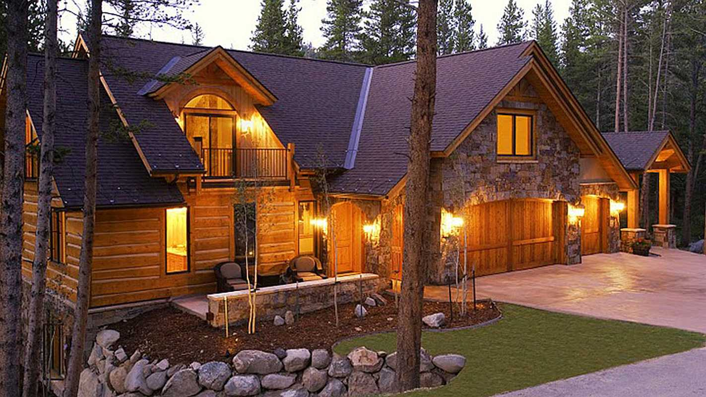 Beautiful log cabin in the forest with a garage